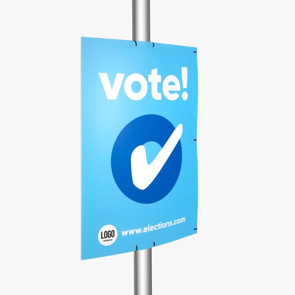 Wahlplakat als großes Poster an einer Straßenlaterne